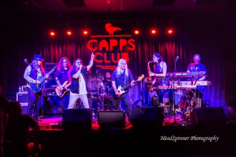 A musical group performing on stage. 