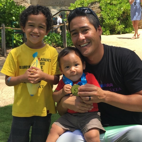 A man and two children.