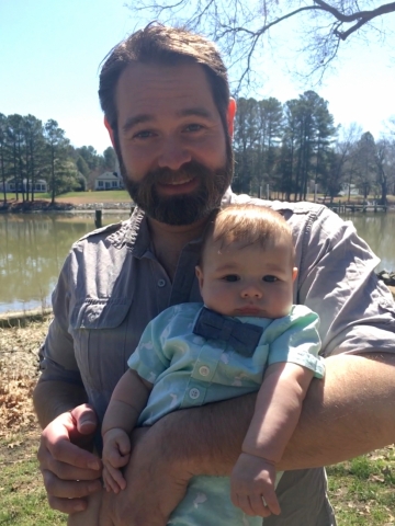 A man holding a baby.