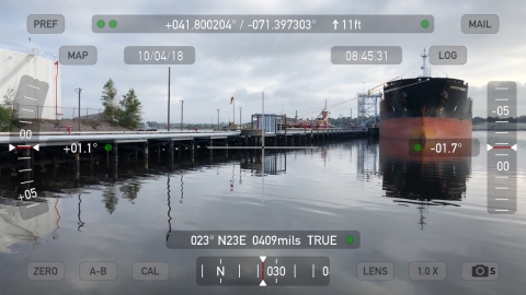 A vessel in water near a pier.