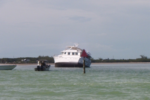 A grounded vessel in water. 