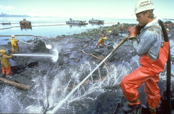 Cleanup workers on an oiled shoreline.