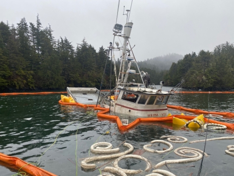 Pollution boom around a sinking vessel. 