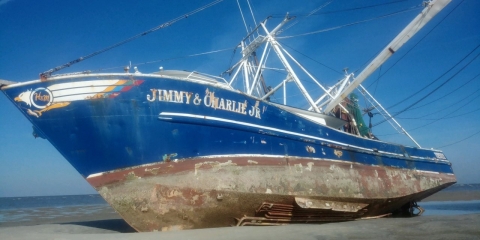 A vessel grounded on a sand bar.