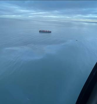 An aerial view of a sheen in water.