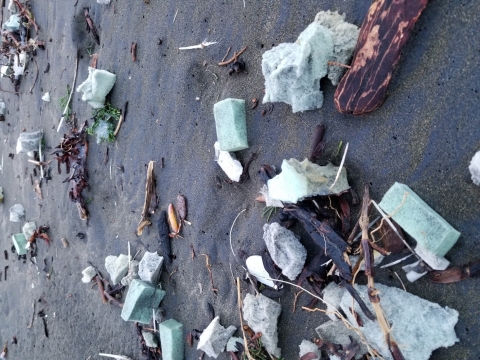 Styrofoam pieces on a beach. 