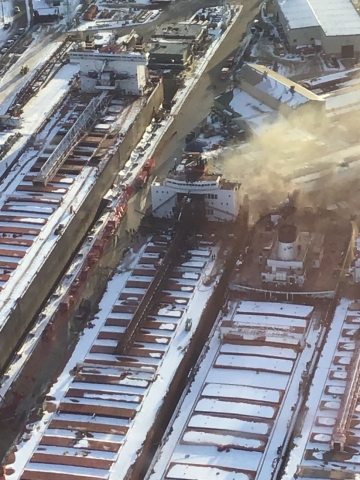 Fire coming from a vessel in icy water. 