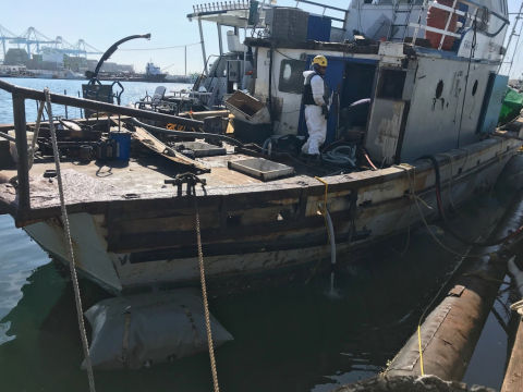 A vessel with people on it.