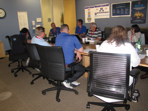 A group of people sitting at a table. 