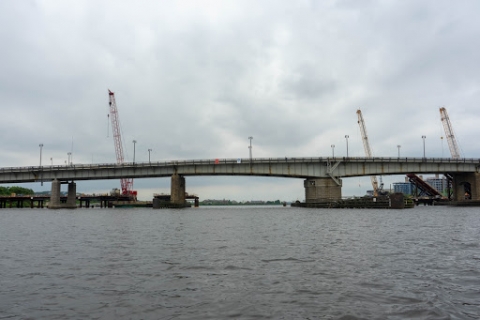 A river with a bridge seen in the background.