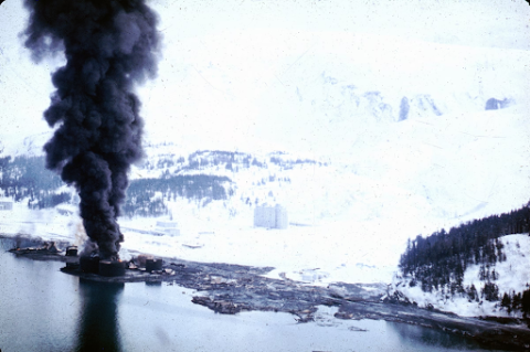 The dock area, a tank farm, and railroad facilities in Whittier, Alaska.
