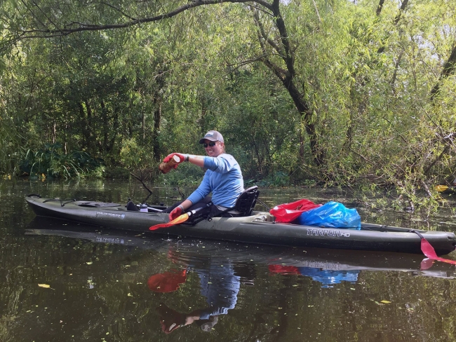 Woman in kayak on the water. 