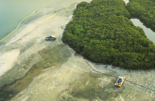 Island with boats and equipment around it.