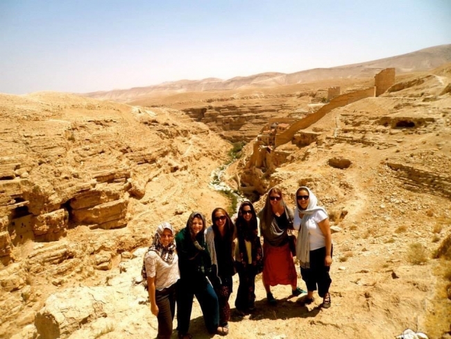 A group of people in the desert. 