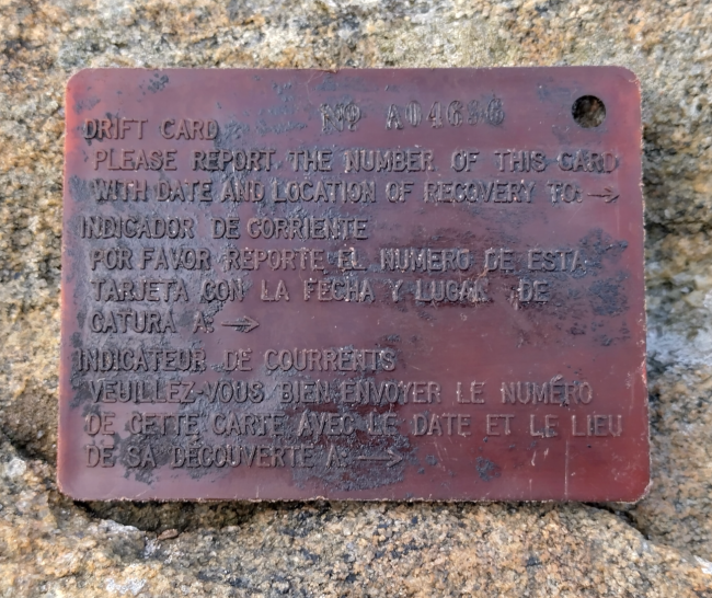 An old plastic drift card with reporting information imprinted on it.