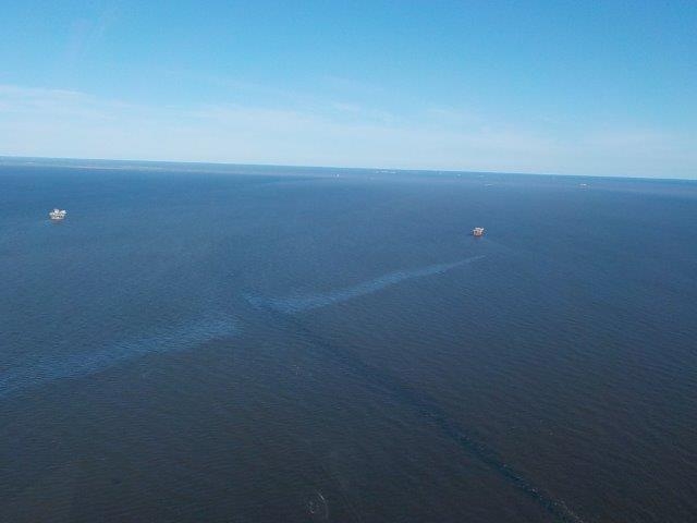 An overflight image showing a visible oil sheen. 