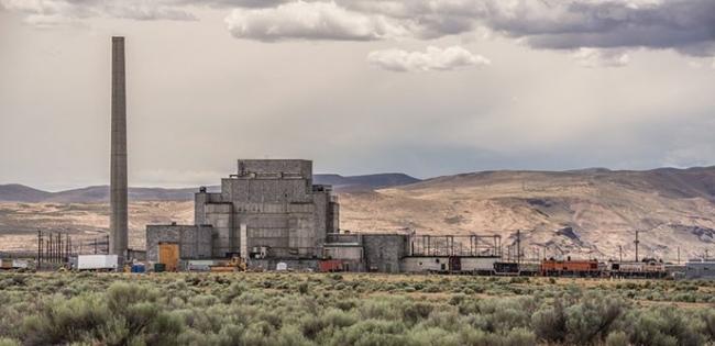 A nuclear reactor with hills in the background. 