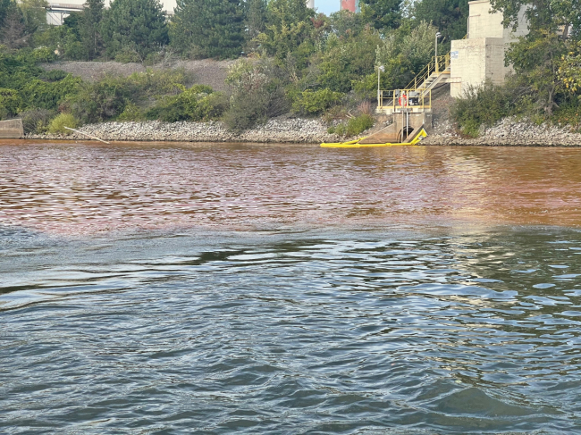 An orange discoloration in water.