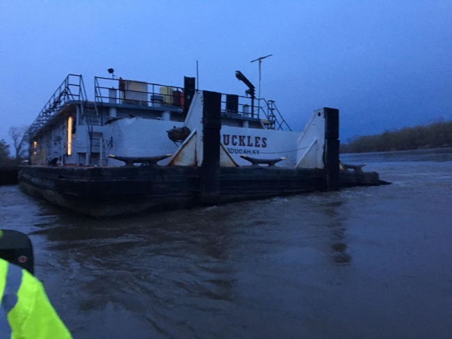 A vessel in the water with the name "Buckles" on it. 