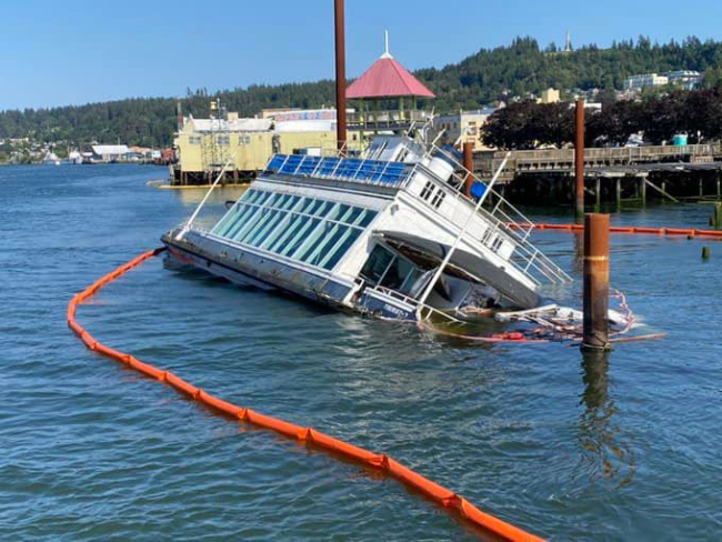 Pollution boom around a sinking vessel.
