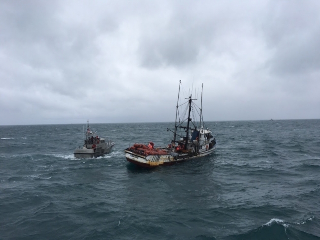 Two vessels in the surf.