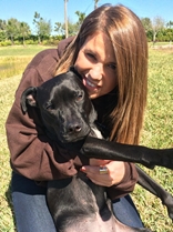 A girl and a dog. 