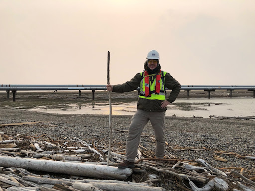 A man standing on a beach.