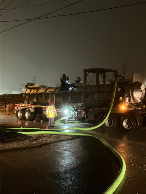 People moving a pumping house.