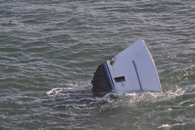 A sunken ship in water. 