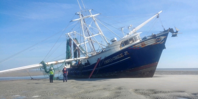 A grounded vessel on a sand bar. 