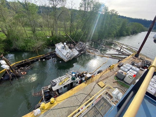 Responders around a derelict vessel.