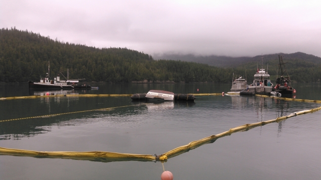 Pollution boom around a sunken vessel. 