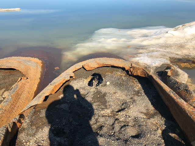 Eroded tanks with tar leaking from them.
