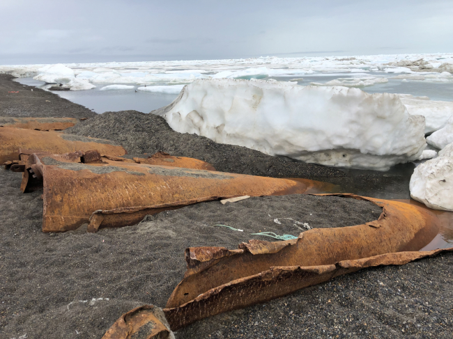 Eroded tanks with tar leaking from them.