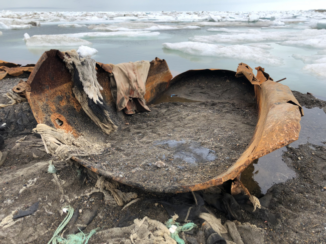 Eroded tanks with tar leaking from them.