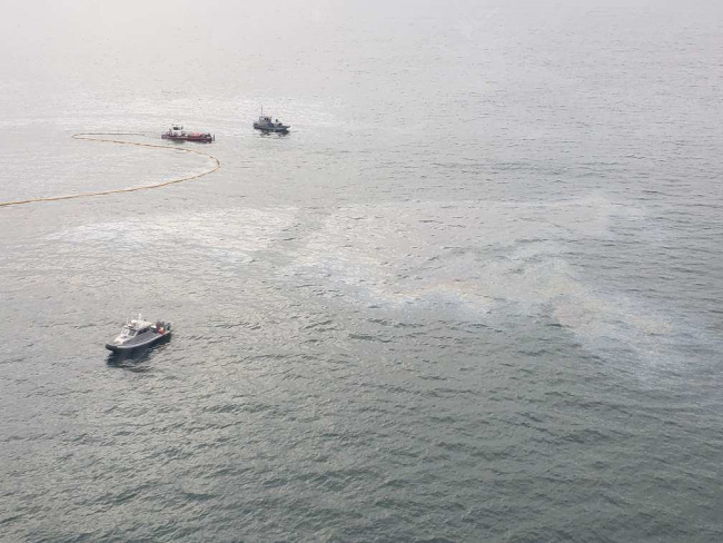 An aerial image of an oil sheen in water.