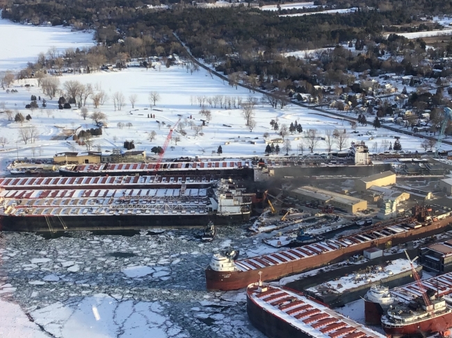 Fire coming from a vessel in icy water. 