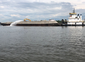 A vessel filled with a pile of oysters. 