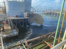 A collapsed tank in water.