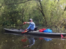 Woman in a kayak on the water.