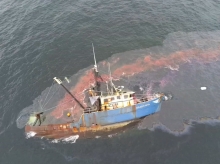 Aerial photo showing significant sheening surrounding a stricken fishing vessel.