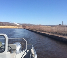 A photo taken from a boat looking out at the river. 