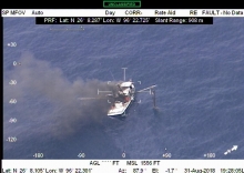 Smoke emitting from a vessel in water. 
