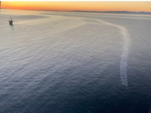 An aerial image of an oil sheen in water.