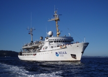 A ship with the NOAA logo on it. 