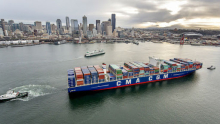 A shipping vessel in a city port.