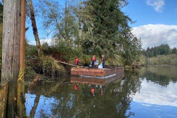 Responders on a derelict barge.