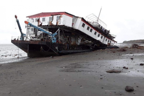 A vessel grounded on a beach.