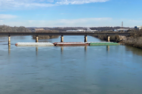 Overturned barges in water.