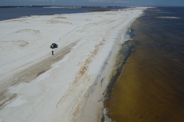 An aerial view of an oiled beach.
